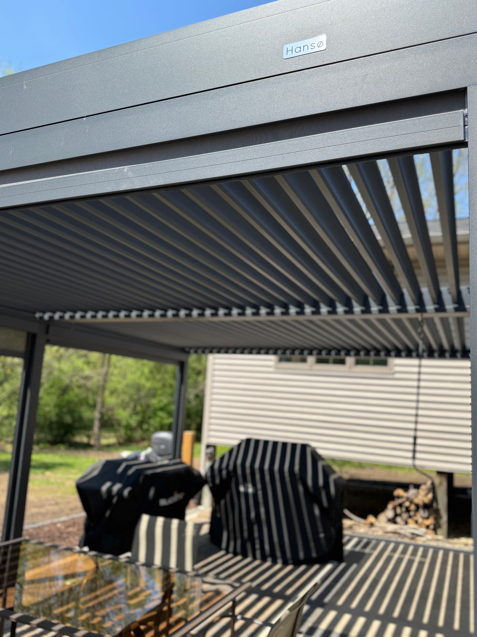 Creating Stunning Backyard Retreats with Pergolas and Firepits image